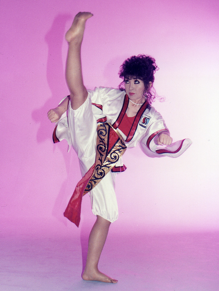 Grandmaster Dr. Tae Yun Kim kicking high